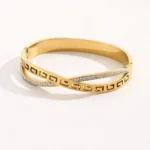 Bracelet Doré Élégance Croisée – Acier Inoxydable & Cristaux